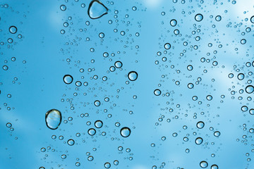 Rain on the window, natural skin of the rain The natural form of rainwater on a sky background.