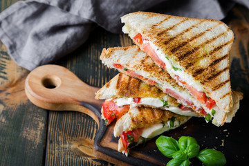 Sandwiches with mozzarella, basil and tomatoes. Italian sandwich