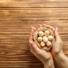 Congratulatory easter background. eggs in female hands