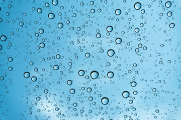 Rain on the window, natural skin of the rain The natural form of rainwater on a sky background.