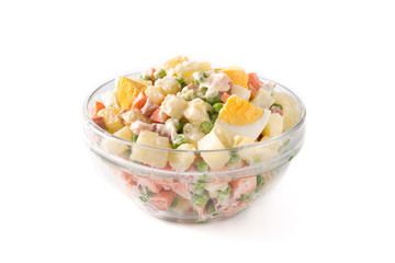 Traditional Russian salad in bowl. Olivier salad isolated on white background