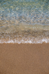 Wave of the sea or ocean in the calm on the sandy coast