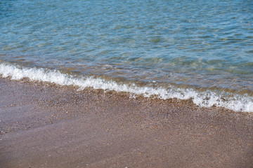 Wave of the sea or ocean in the calm on the sandy coast