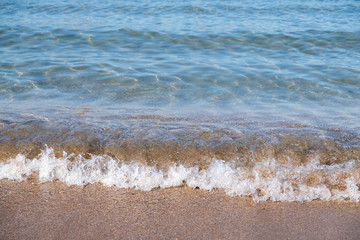Wave of the sea or ocean in the calm on the sandy coast