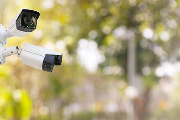 Outdoor and waterproof ip security surveillance video camera in a public park.