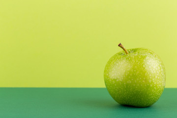 Creative layout made of green apples. Flat lay. Food concept.