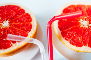 red grapefruit on a white plate