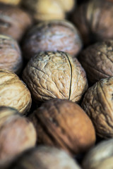 whole unpeeled brown nuts background