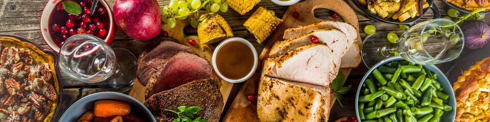 Thanksgiving family dinner setting concept. Traditional Thanksgiving day food  with turkey, green...