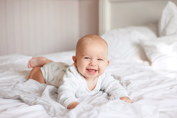 happy baby on the bed