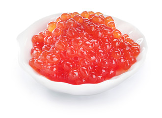 Plate with red caviar on white background
