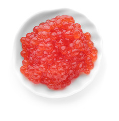 Plate with red caviar on white background