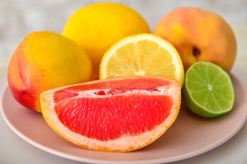 Tasty fresh fruits on plate, closeup