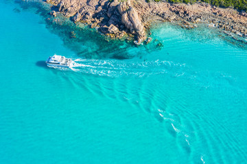 Ripples behind boat in turquoise water near Dunsborough in Western Australia