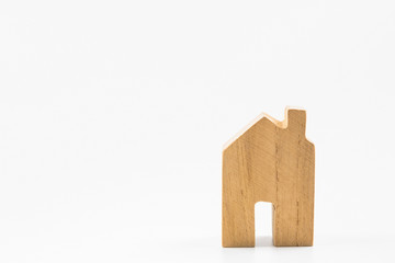 Obraz na płótnie Canvas Wooden house toy on white background with copy space.Real estate concept, New house concept, Finance loan business concept.