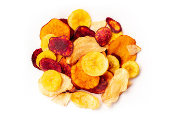 Dry fruit and vegetable chips, healthy vegan snack, a mixed heap on a white background