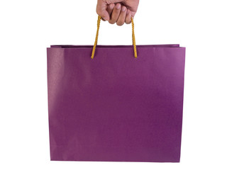 Shopping paper bag held by hand. (clipping path)