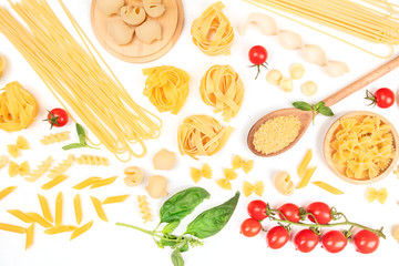 Italian pasta on a white background. Spaghetti, pappardelle, orzo, farfalle and other types, with tomatoes and basil
