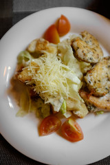 Caesar salad with chicken and crackers