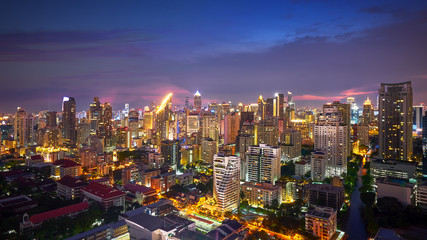 Fototapeta premium night cityscape lighting up and twilight skyline in metropolis