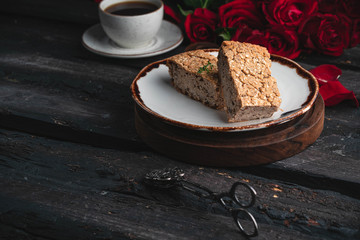 homemade healthy bread, red roses and cup of coffee on the background