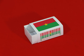 Burkina Faso flag on white box with barcode and the color of nation flag on red background, paper packaging for put match or products.