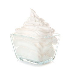 Whipped cream in bowl on white background
