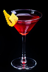 Cosmopolitan classic cocktail with reflection on a dark background