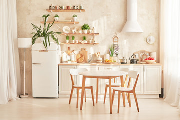 white scandinavian style kitchen with dining table
