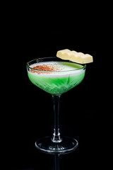 classic grasshopper cocktail with reflection on a dark background