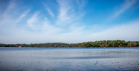 blue sky with a beautiful lake and white clouds