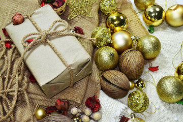 Gift boxes, Christmas tree golden ball,red heart put on sackcloth. Preparing to celebrate Christmas.