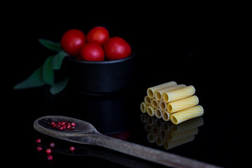 Italian pasta raw rigatoni reflection isolated on black background - Immagine