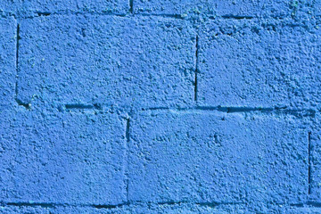 blue wall with rough blocks, wall with blue paint