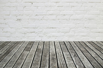 white brick wall and wood floor
