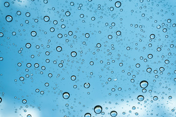 Rain on the window, natural skin of the rain The natural form of rainwater on a sky background.