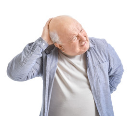 Senior man suffering from headache on white background