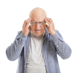 Senior man suffering from headache on white background