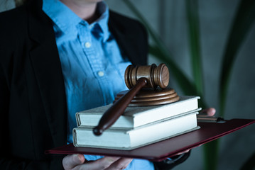 lawyer judge reading documents at desk in courtroom