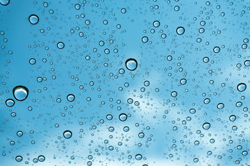 Rain on the window, natural skin of the rain The natural form of rainwater on a sky background.