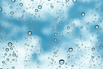 Rain on the window, natural skin of the rain The natural form of rainwater on a sky background.