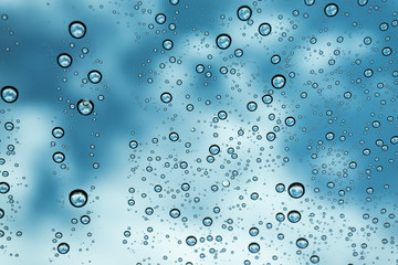 Rain on the window, natural skin of the rain The natural form of rainwater on a sky background.