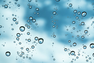 Rain on the window, natural skin of the rain The natural form of rainwater on a sky background.