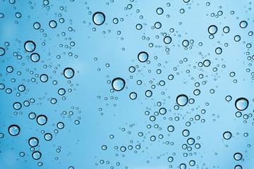 Rain on the window, natural skin of the rain The natural form of rainwater on a sky background.