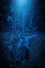 dead man lying in grave