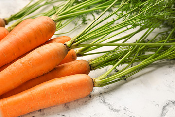 Fresh carrots on light background