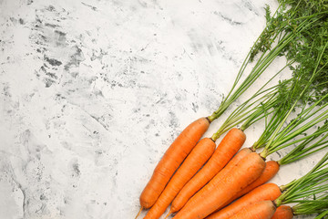 Fresh carrots on light background