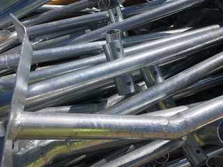 Chrome plated formwork supporting metal pipes in the box on the outdoor warehouse