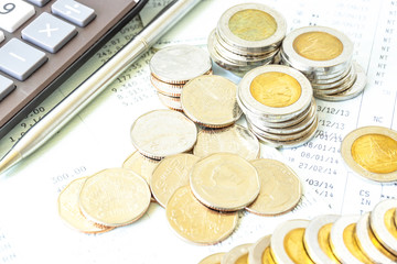 Concept of currency trading, making a decision for an optimal gain. Graph and rows of coins for finance and business concept.