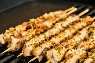 Cooking souvlaki on grill